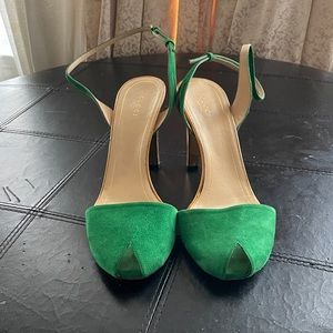 Here’s a peak toe, suede emerald green sling back Gucci heel. Mint condition!